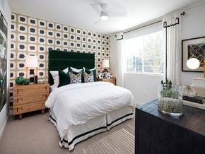 Chula Vista apartment for rent - a bedroom with a white bed and a green headboard