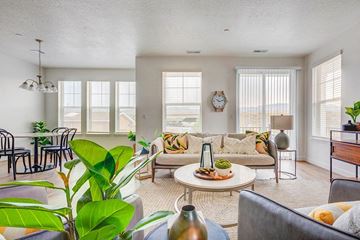 Riverton apartment for rent - A living room with a couch, chairs, and a table with a vase on it.