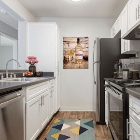 Livermore apartment for rent - A kitchen with a stainless steel refrigerator, stove, dishwasher and sink.