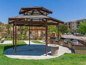 San Diego apartment for rent - A gazebo is surrounded by a grassy area and a concrete walkway.