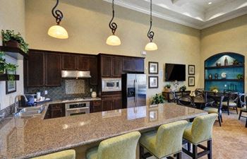 Slab granite countertops in kitchen at 