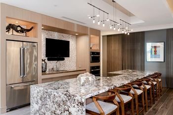 Resident kitchen with breakfast bar and dining space
