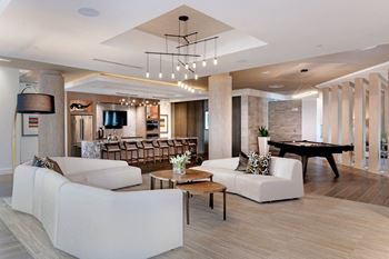Smart tv lounge with billiards and conversational seating areas