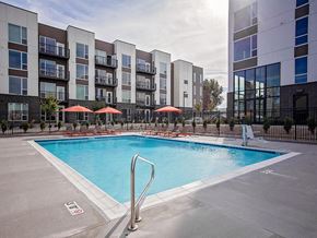 Salt Lake City apartment for rent - Outdoor pool with lounge seating and umbrellas