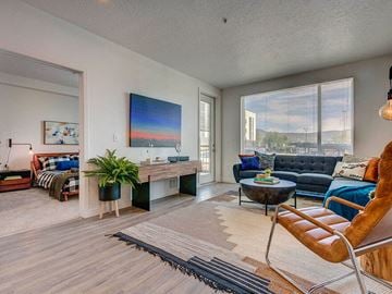 Salt Lake City apartment for rent - a living room with a large window and a couch