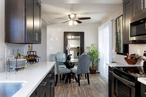 San Diego apartment for rent - A kitchen with a dining table and chairs at The Casas Apartments, San Diego, CA