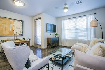 Las Vegas apartment for rent - a living room with white furniture and a large window