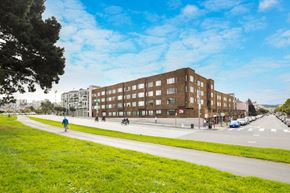 San Francisco apartment for rent - a view of a building on a street with a grassy area in front of it