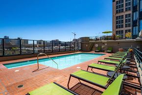 San Francisco apartment for rent - a pool on the top of a building with a city in the background