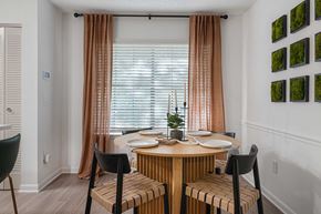 Nashville apartment for rent - a dining area with a wooden table and four chairs