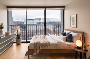 Salt Lake City apartment for rent - a bedroom with a large bed and a window
