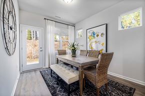 Fuquay-Varina townhouse for rent - a dining room with a table and chairs and a door at Ashford Townes Apartments, North Carolina