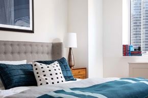 New York apartment for rent - a bedroom with a bed and a window