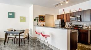 Atlanta apartment for rent - a kitchen with a bar and a dining table