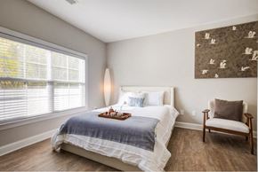 Manassas Park apartment for rent - a bedroom with a bed and a chair and a window