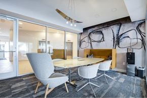 Manassas Park apartment for rent - a conference room with a glass table and chairs