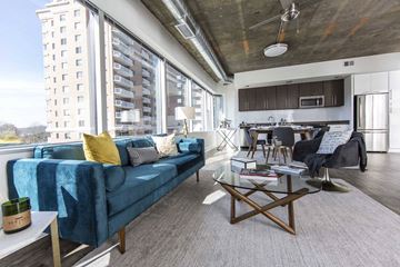 Alexandria apartment for rent - a living room with a blue couch and a table