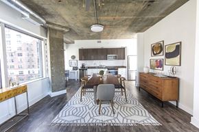 Alexandria apartment for rent - a dining room with a wooden table and a large rug