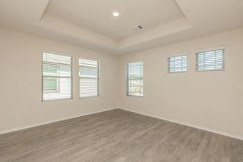 Empty room with multiple windows with natural light