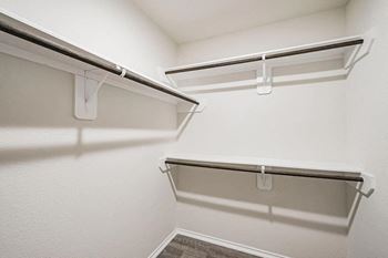 Spacious walk-in closet with shelves