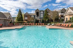 Raleigh apartment for rent - a large swimming pool with apartments in the background
