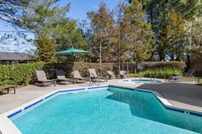 Martinez apartment for rent - a swimming pool with chairs and a poolside umbrella