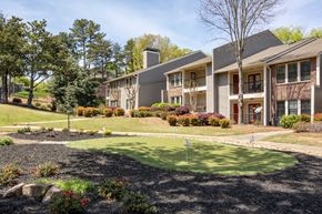 Atlanta apartment for rent - a putting green in front of an apartment building