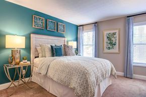 Atlanta apartment for rent - a bedroom with a bed and two windows