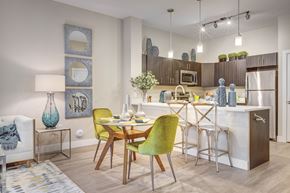 Herriman apartment for rent - Living room and kitchen at Incline at Anthem senior apartments in Herriman
