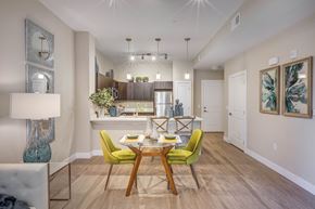 Herriman apartment for rent - a dining room and kitchen with a table and chairs