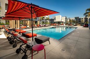 North Hollywood apartment for rent - a swimming pool at a hotel with chairs and umbrellas