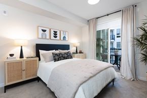 Milpitas apartment for rent - a bedroom with a bed and a large window