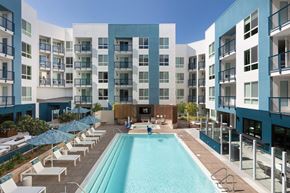 Milpitas apartment for rent - a swimming pool at an apartment building with a pool and lounge chairs