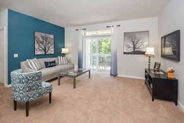 Elkridge apartment for rent - a living room with a couch and a table