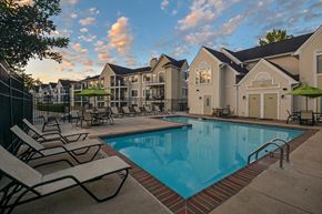 Ellicott City apartment for rent - our apartments have a swimming pool with chairs and umbrellas