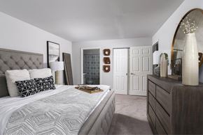 Ellicott City apartment for rent - a bedroom with a bed and a dresser and a closet
