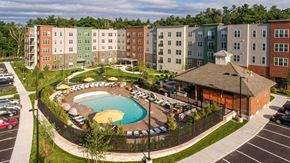 Stoneham apartment for rent - an aerial view of an apartment building and a swimming pool