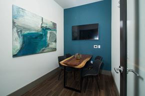 Stoneham apartment for rent - a dining room with a table and chairs and a television