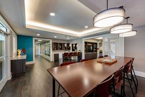 Capitol Heights apartment for rent - amenity clubroom with long table and chairs