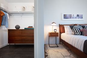 Oakland apartment for rent - a bedroom with a bed and a dresser and a closet