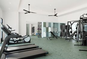 Gresham apartment for rent - a gym with treadmills and other exercise equipment in a room with white walls