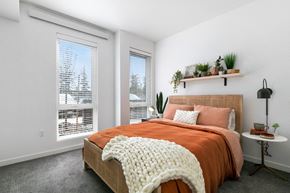 Gresham apartment for rent - a bedroom with a bed and two windows