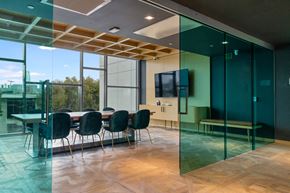 San Francisco apartment for rent - a conference room with glass walls and a table and chairs