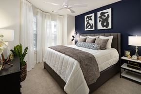 Brookhaven apartment for rent - a bedroom with a large bed and a blue accent wall
