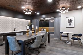 Houston apartment for rent - a dining room with a long table and chairs