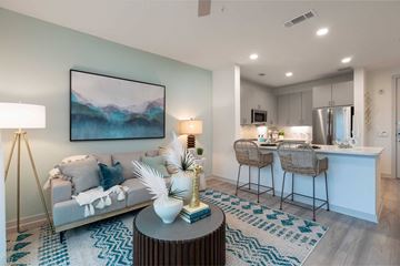 Houston apartment for rent - a living room with a couch and a table