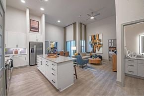 Allen apartment for rent - a kitchen and living room with an island in the middle