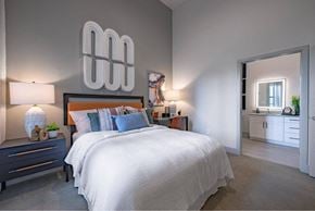 Allen apartment for rent - a bedroom with a large bed and a mirror