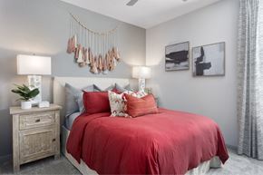 Surprise apartment for rent - the preserve at ballantyne commons apartment bedroom with red bed