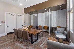 Surprise apartment for rent - a dining room with a wooden table and chairs
